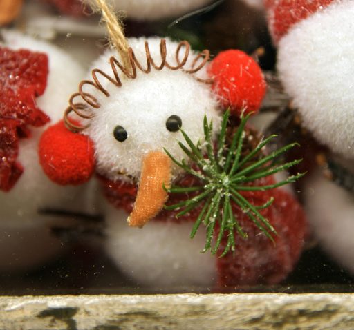 9. Sock Snowmen Fill a white sock with rice, tie off sections to form a body, and decorate with buttons, a scarf, and a hat. Video Tutorial: DIY Sock Snowmen 